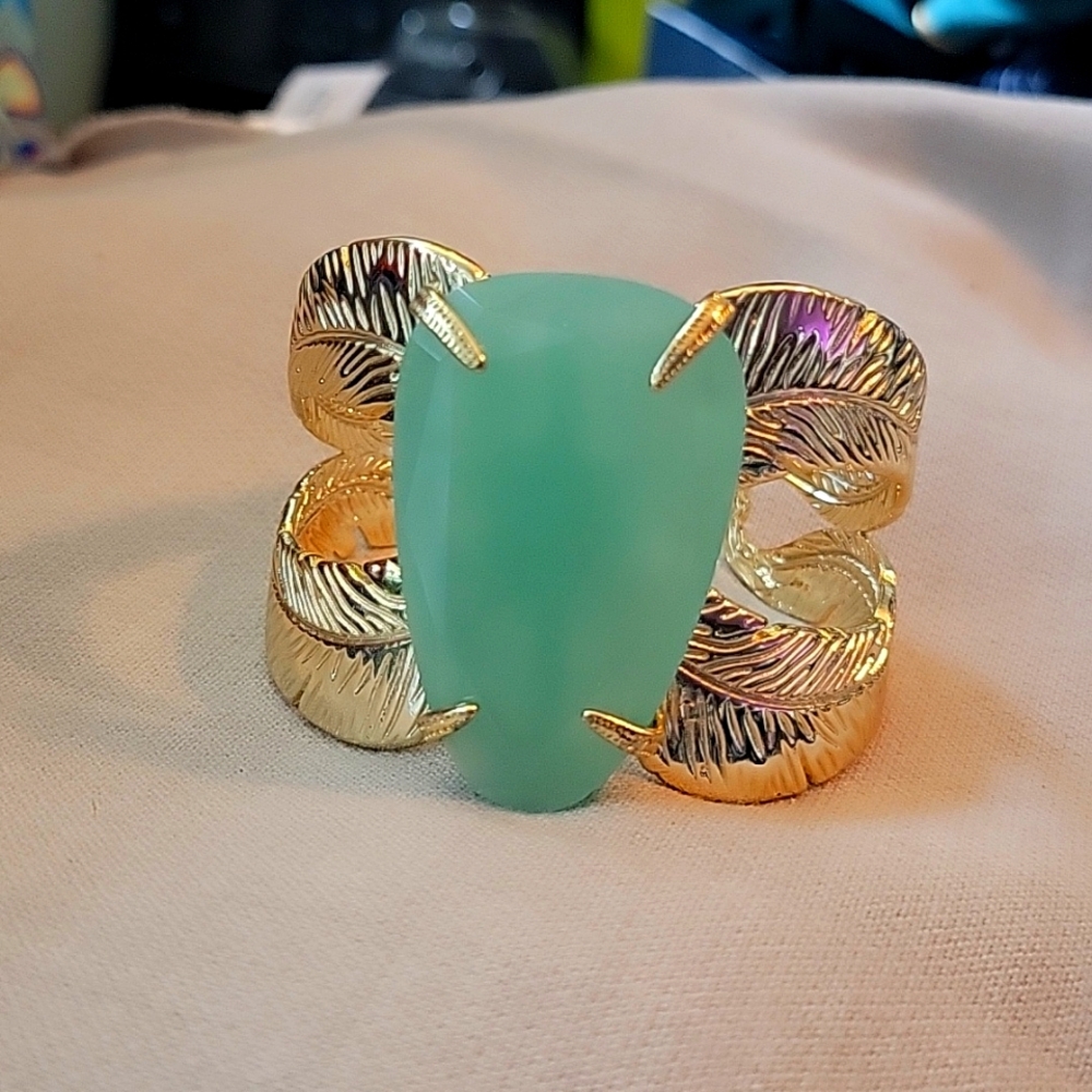 Hard cuff bracelet with aqua center piece